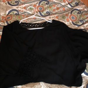 Black blouse with lace on bottom of sleeves & back